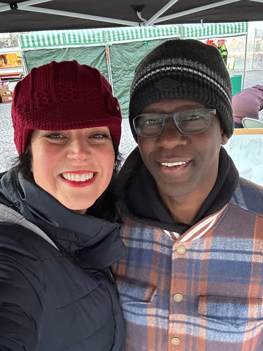 My hubs and I standing at a market.  Little did I know that starting a business would mean loving working with my husband.